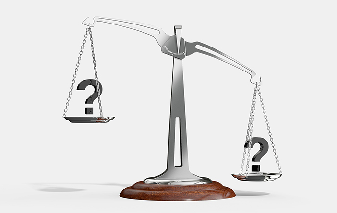 unbalanced question marks on a set of scales