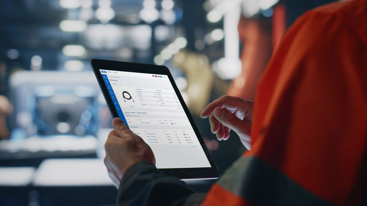 Person checking reliability certifications on a tablet