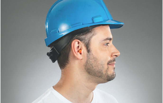 Man with blue hard hat and ear protection