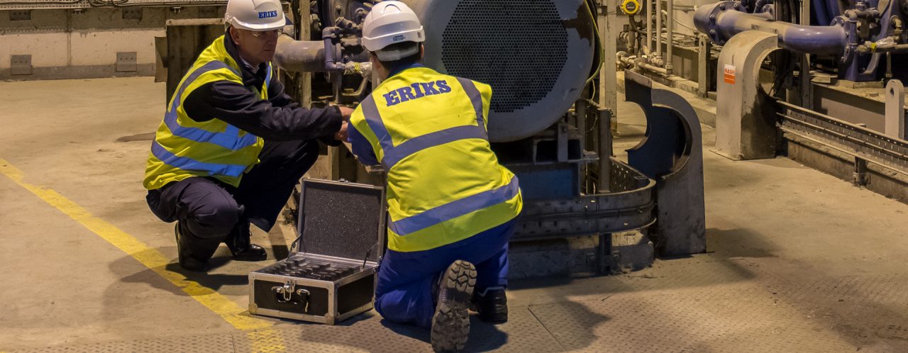 Engineers working on large motor