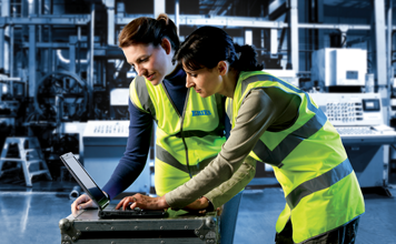 ERIKS procurement staff working on computor